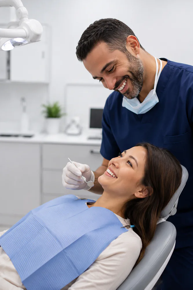 A JSA Dental Care dentist gently caring for a relaxed patient in McDonough